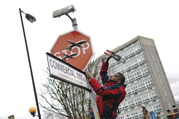 Suspect arrested in alleged theft of a Banksy stop sign decorated with military drones