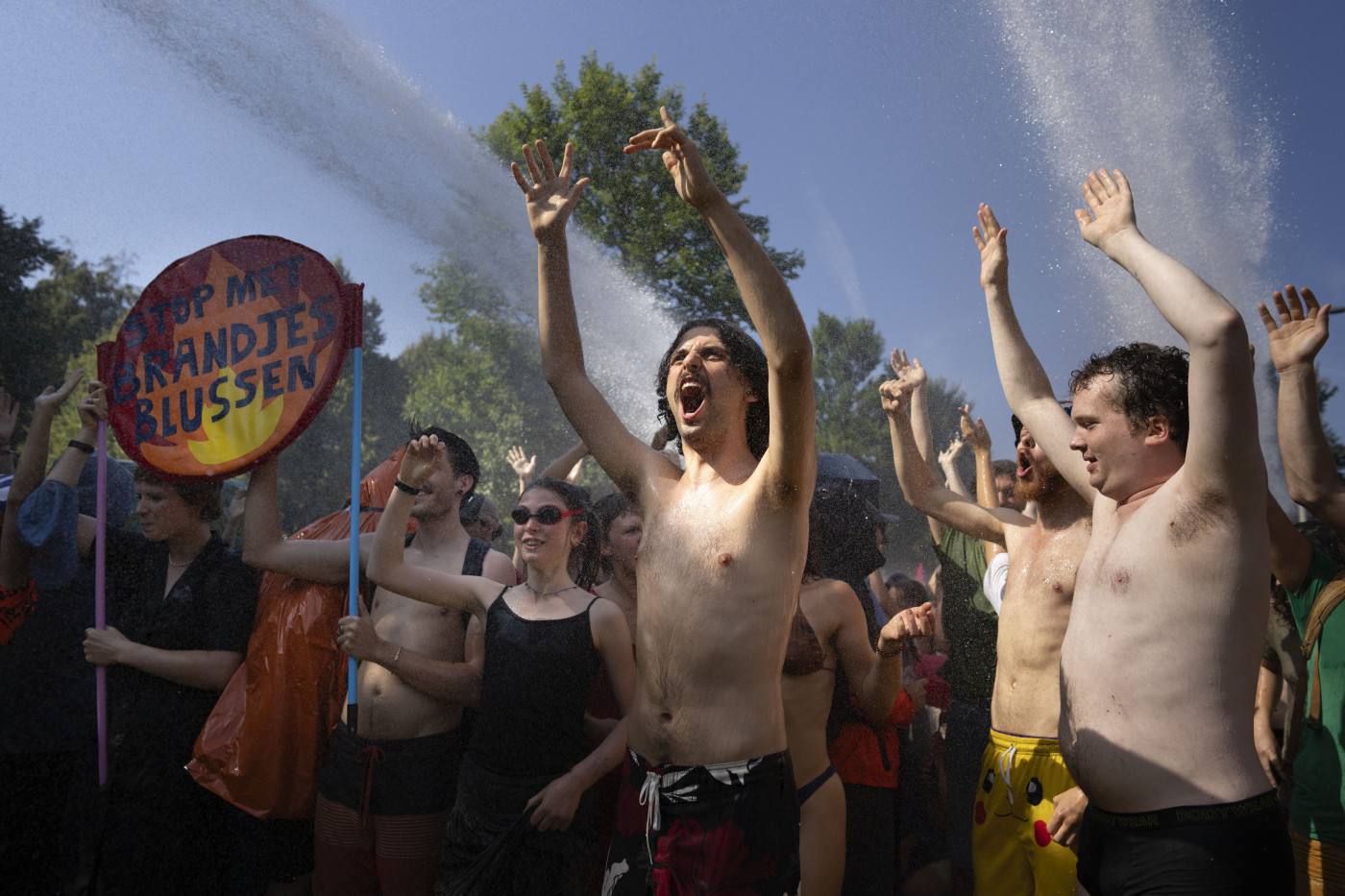 Dutch police use water cannon, detain 2,400 climate activists