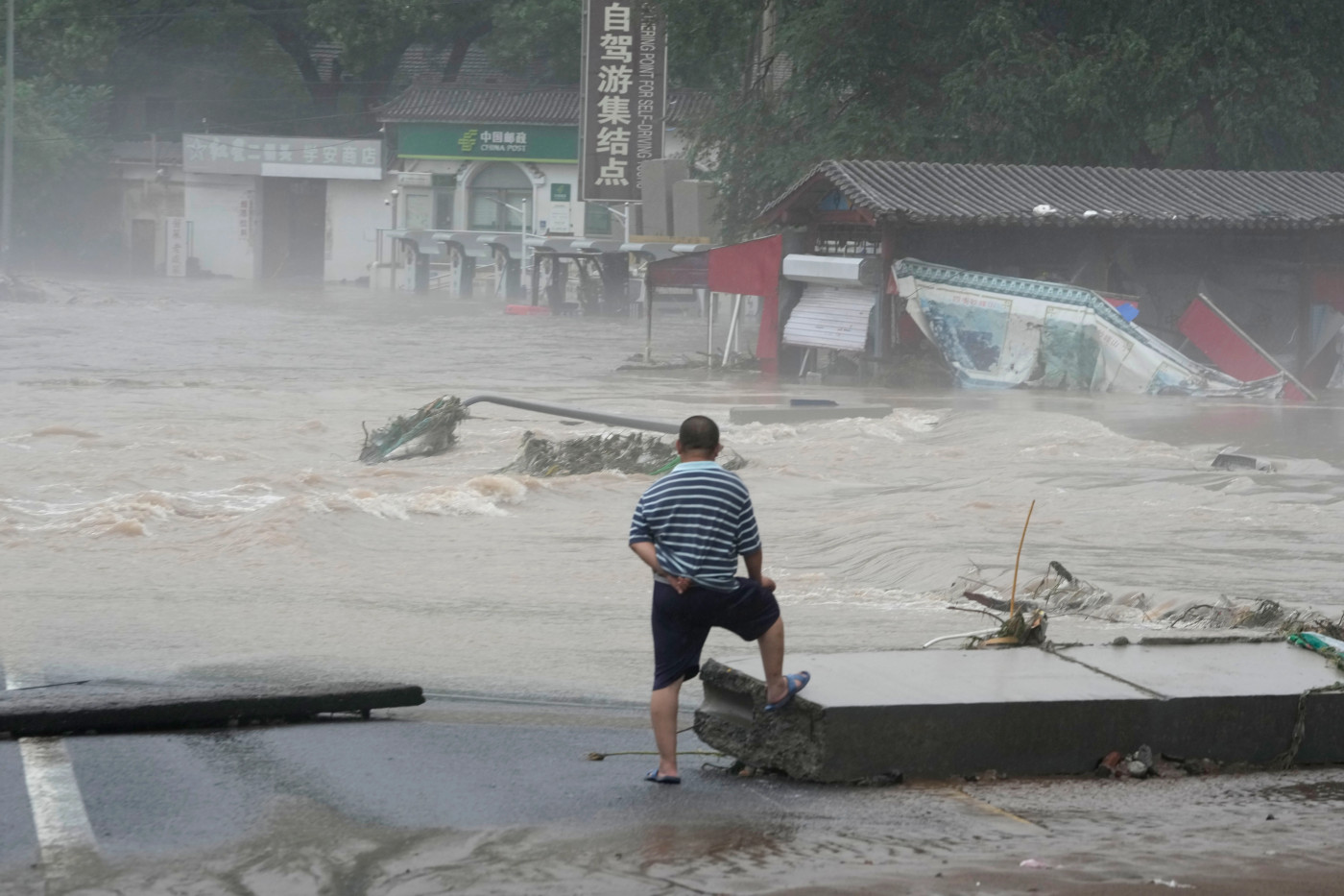 China’s heaviest rains in 140 years kill at least 20, leave 27 missing