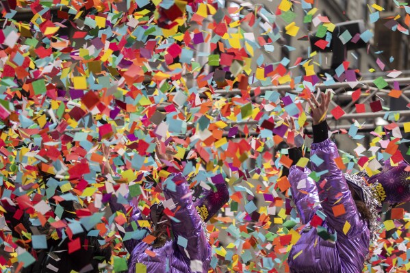 Air in Times Square filled with colored paper as organizers test New Year’s Eve confetti