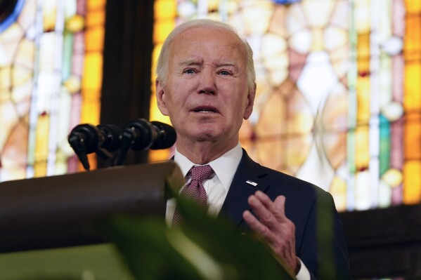 Biden condemns white supremacy in campaign speech at church where Black people were killed