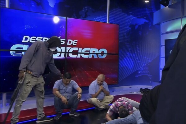 Ecuador’s escalating gang violence is broadcast live to the nation as masked gunmen storm TV studio