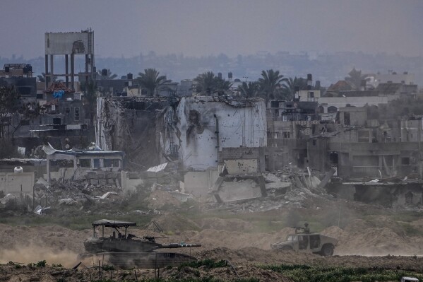 Displaced Palestinians leave one of Gaza’s main hospitals after weeks of being isolated by fighting