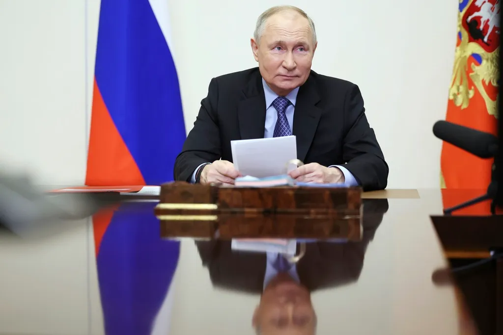 Russia’s Putin signs law to seize assets of those who discredit military