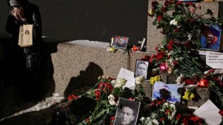 Tributes to Alexei Navalny, Putin’s greatest foe, removed from Russian cities as police look on