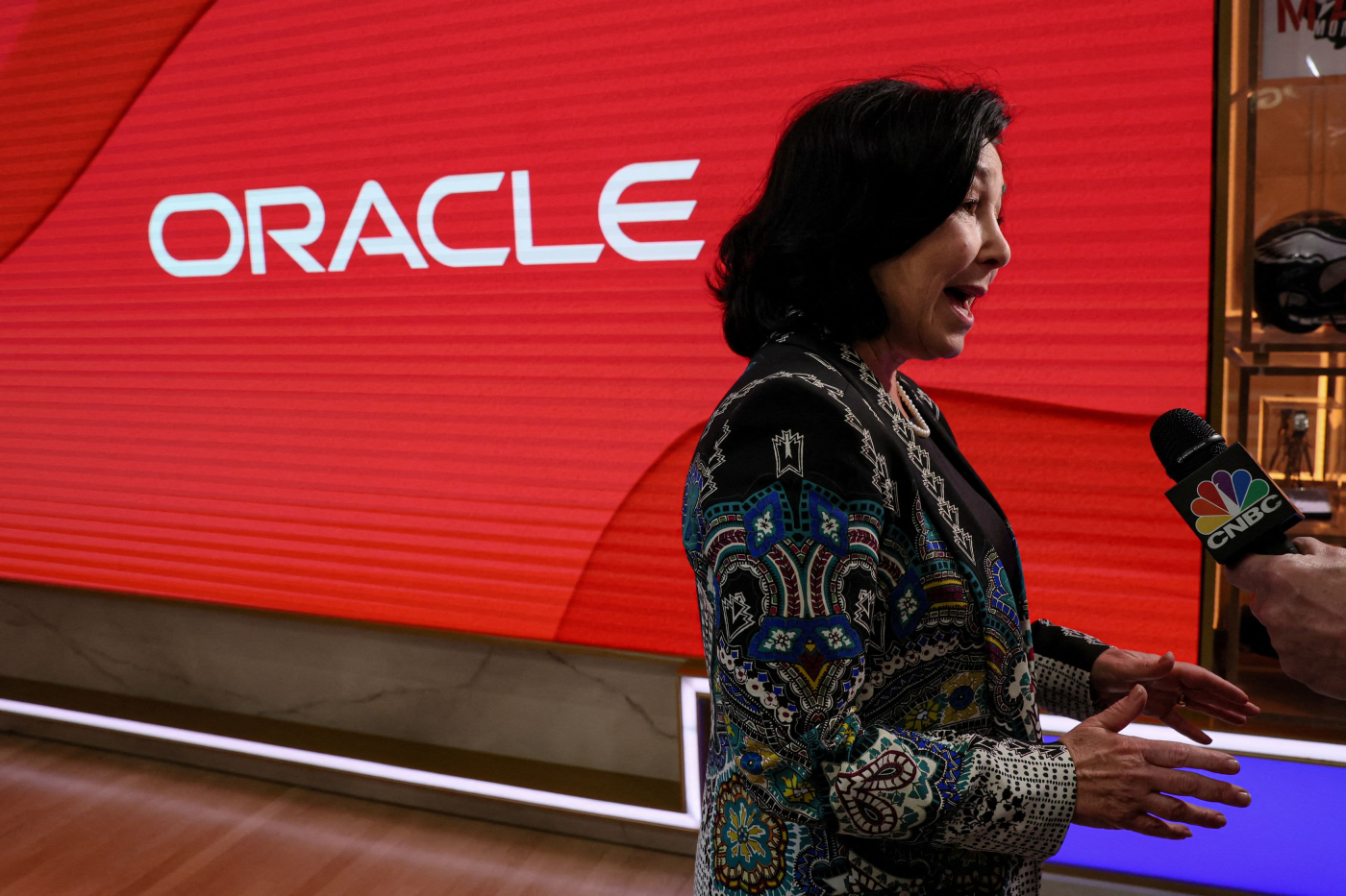 Oracle shares surge 12% and head for record close