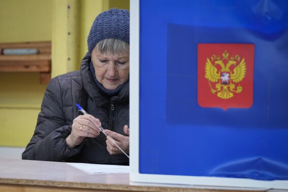 Russians cast ballots on Day 2 of an election preordained to extend Putin’s rule