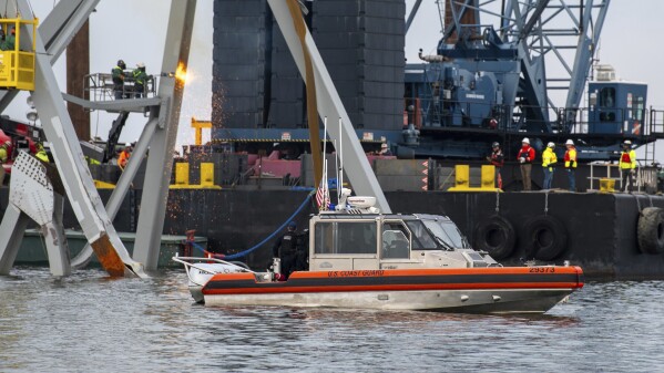 Crews at Baltimore bridge collapse continue meticulous work of removing twisted steel and concrete