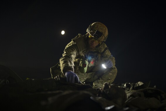 The true toll of the war in Ukraine is measured in bodies. This man brings them home, one at a time