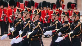 British, French troops march in historic joint parades in London and Paris in a show of solidarity