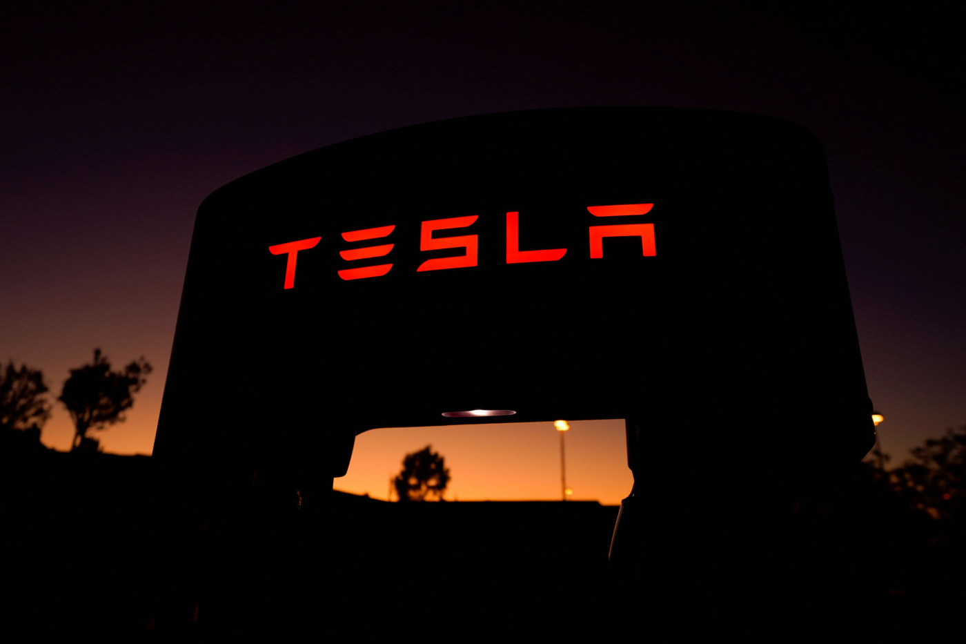 Tesla shares dip in premarket trade after reports the firm will lay off more than 10% of global workforce