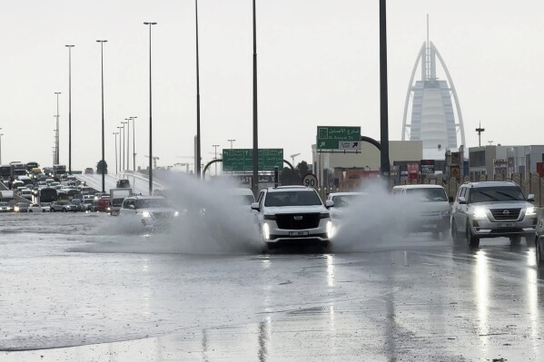 A storm dumps record rain across the desert nation of UAE and floods the Dubai airport