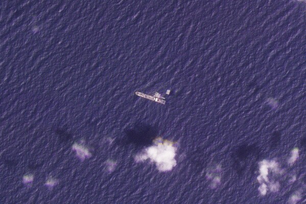 Satellite photos show US Navy ship building floating pier for Gaza aid as Israel-Hamas war rages