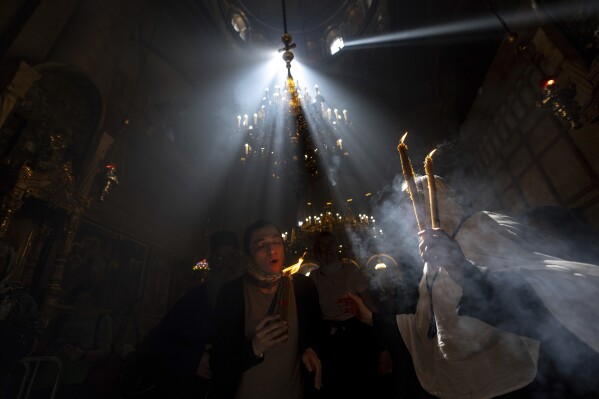 Cheers and flames as Orthodox worshipers greet the ancient ceremony of the ‘Holy Fire’