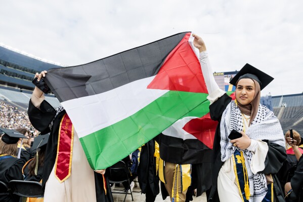 Small anti-war protest ruffles University of Michigan graduation ceremony