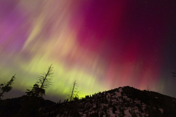 Federal agency says a second, if weaker, solar storm surge is likely Sunday