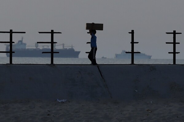 More aid getting from US pier to people in Gaza, officials say, after troubled launch