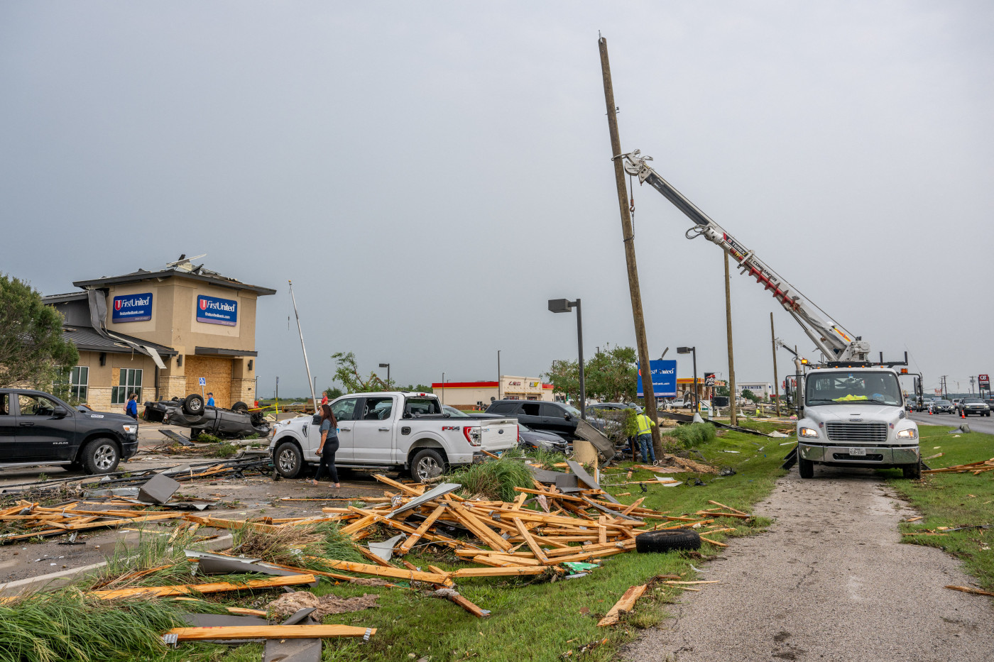 At least 11 people, including two children, killed in US tornadoes, storms