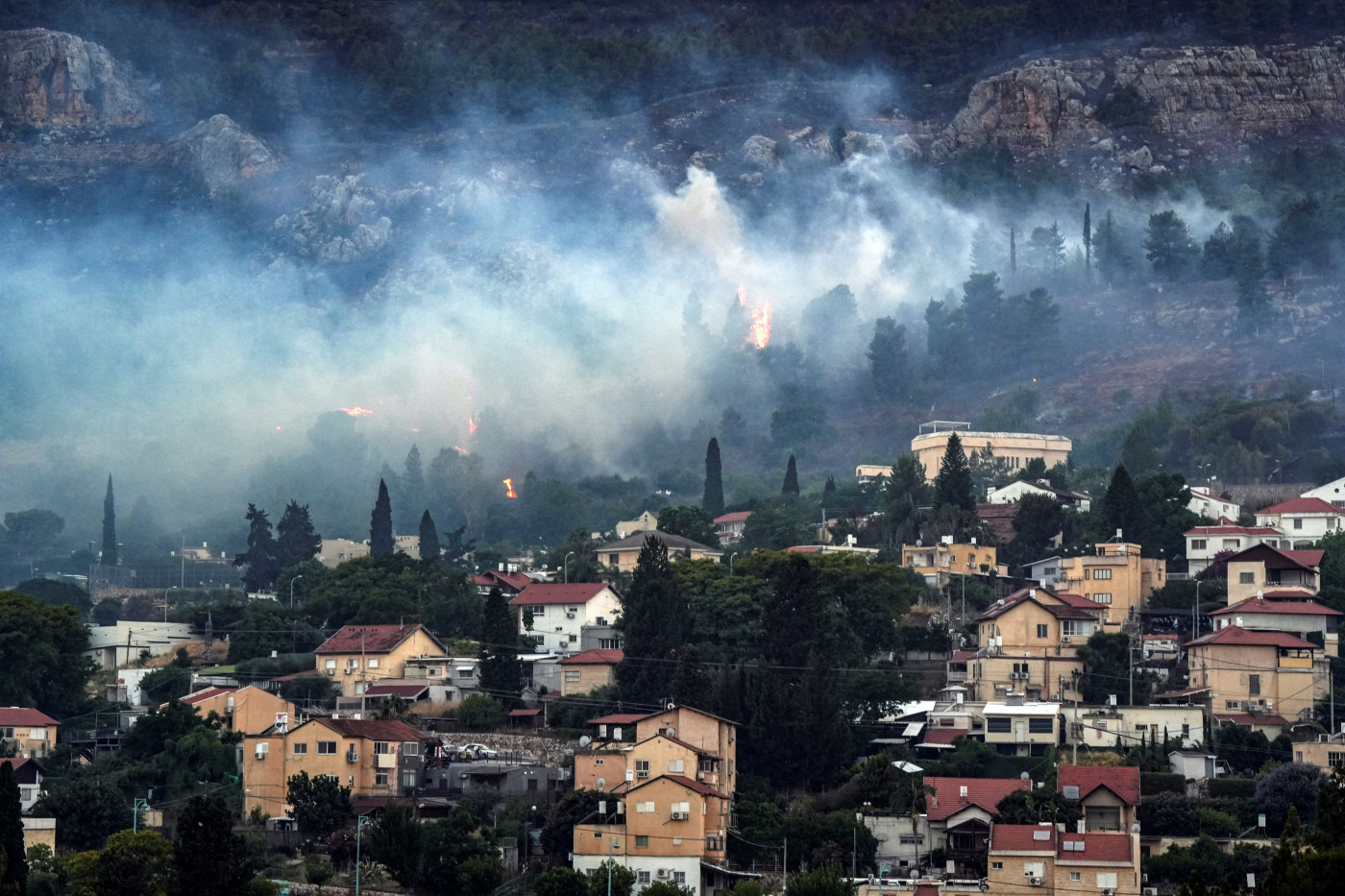 Hezbollah rains rockets on Israel after senior commander killed