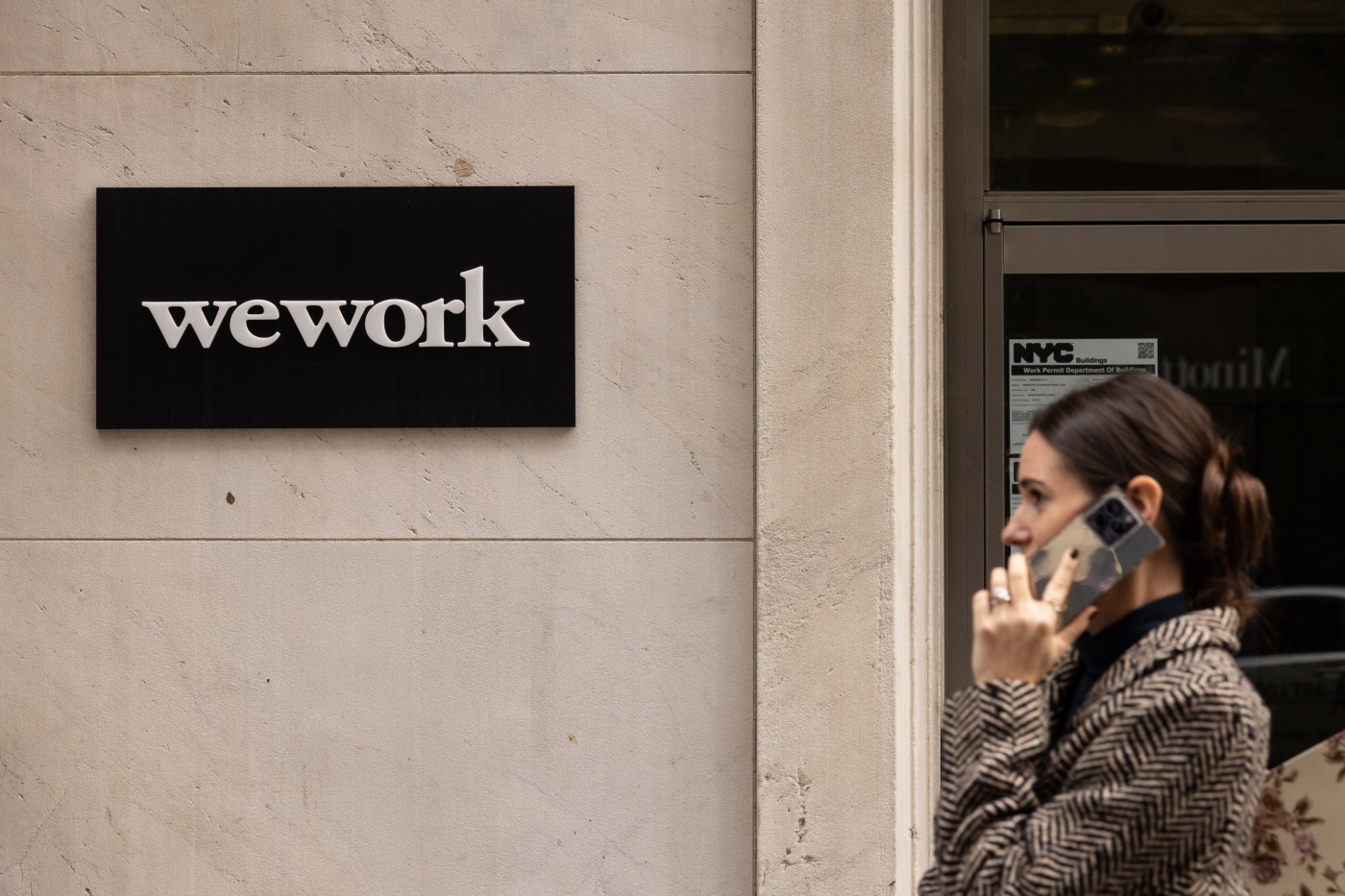 WeWork emerges from bankruptcy, announces John Santora as new CEO