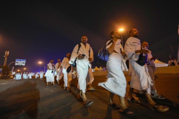 Muslim pilgrims converge at Mount Arafat for daylong worship as Hajj reaches its peak