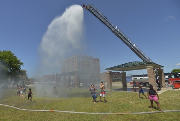 Early blast of heat and humidity leaves millions sweltering across the US