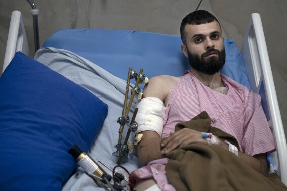 A Palestinian was shot, beaten and tied to an Israeli army jeep. The army says he posed no threat