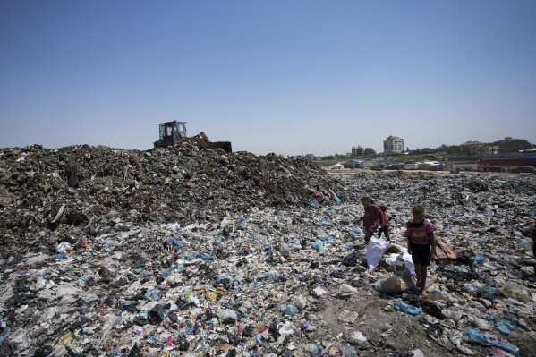 In the searing heat of the Gaza summer, Palestinians are surrounded by sewage and garbage