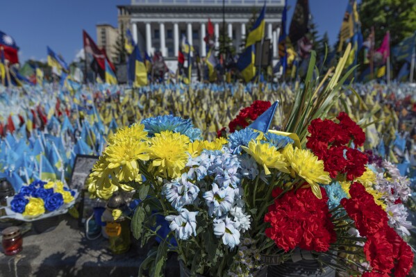 A precious moment in time of war: Flowers for a wife and daughter coming home to Ukraine