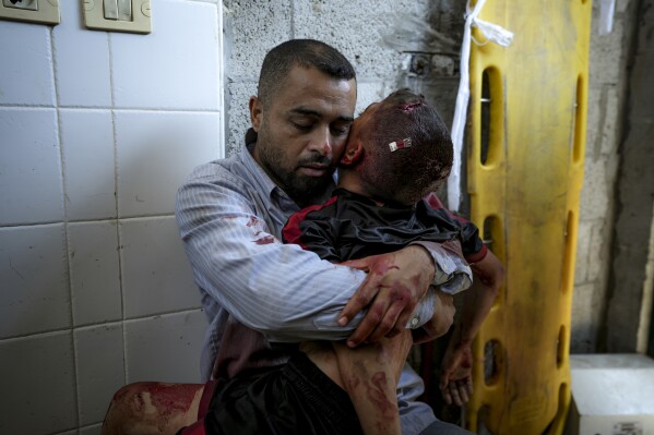 A boy in Gaza was killed by an Israeli airstrike. His father held him and wouldn’t let go