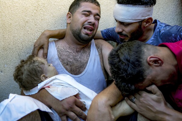 A Gaza father mourns his baby boy, killed in bed by an Israeli airstrike