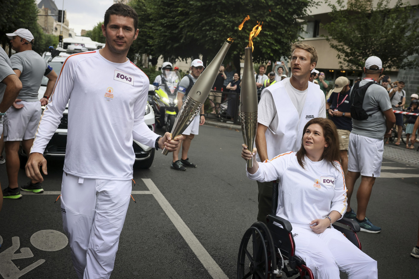 Lebanese journalist wounded in Israeli strike carries Olympic torch