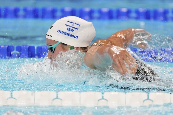 Israeli swimmer of Ukranian parents tries to forget conflicts as she competes at the Olympics