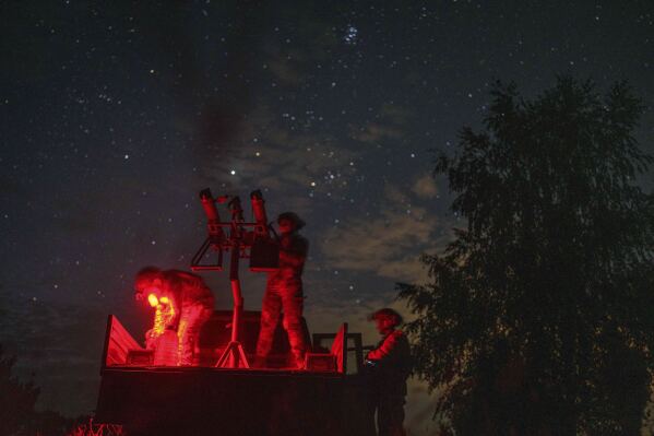 With men at the front lines, women watch over Ukraine’s night sky for Russian drones