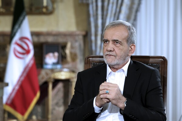 Iran’s new president travels to neighboring Iraq on his first trip abroad