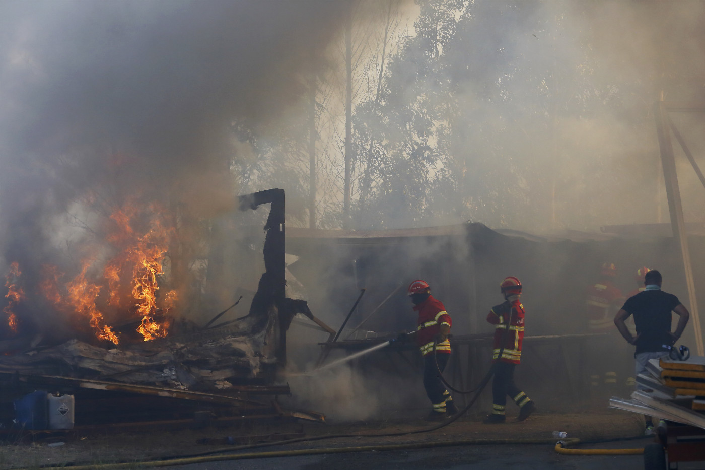 Three firefighters die as Portugal battles dozens of wildfires