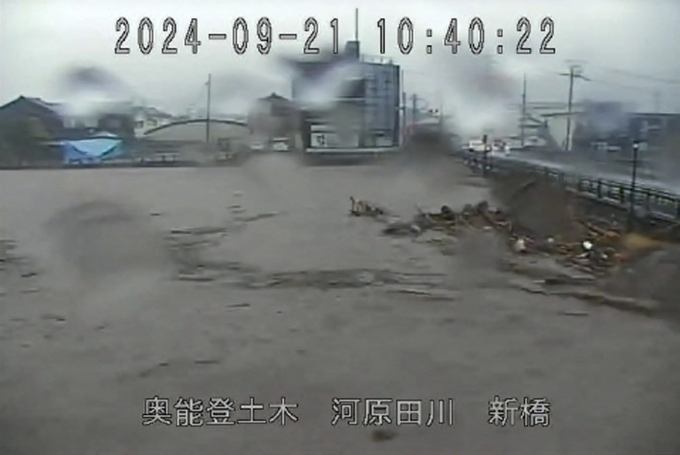 Japan orders thousands to evacuate quake-hit region as rains trigger floods